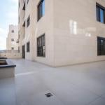 Spacious 2-Bedroom Apartment for Rent in Deir Ghbar – Ground Floor with Terrace, Parking & Elevator