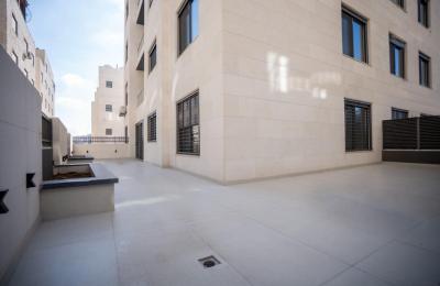 Spacious 2-Bedroom Apartment for Rent in Deir Ghbar – Ground Floor with Terrace, Parking & Elevator
